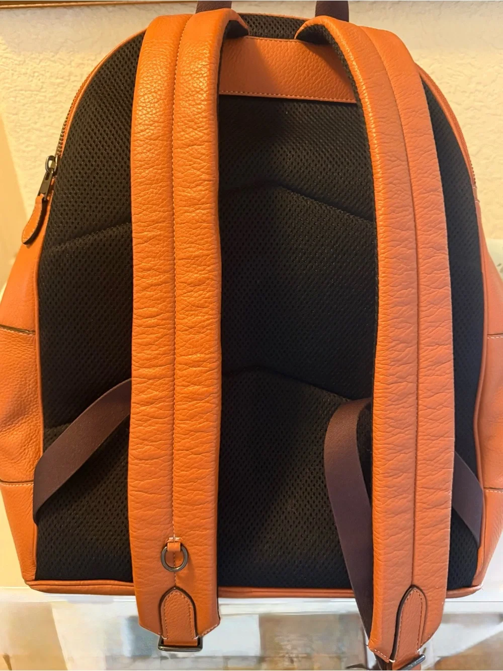 COACH Orange Pebbled Leather Men's Backpack with Front Logo Pocket
